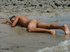 A lusty bronzed latino twink poses nude for the camera showing the extra