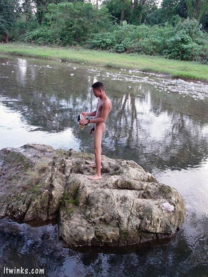 Frolicking in the water is a nude dark skinned horny latino enjoying whacking of his extra large cock and spewing jizz on himself - Picture 15