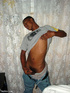 A randy and very dark young latino hunk displays his already heavily aroused