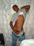 A randy and very dark young latino hunk displays his already heavily aroused