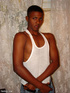 A randy and very dark young latino hunk displays his already heavily aroused