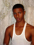 A randy and very dark young latino hunk displays his already heavily aroused