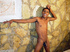 A lewd latino twink poses nude in different areas of a room displaying