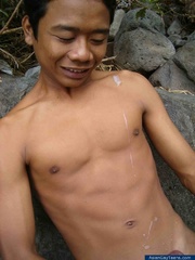 Nature lover guy gets nude by rocks and water and jerks of his cock to spray cum