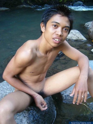 Young guy with bushy dick has fun playing with himself by water and rocks - Picture 5