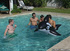 Water fun and games as cute gay friends have fun in water and later on