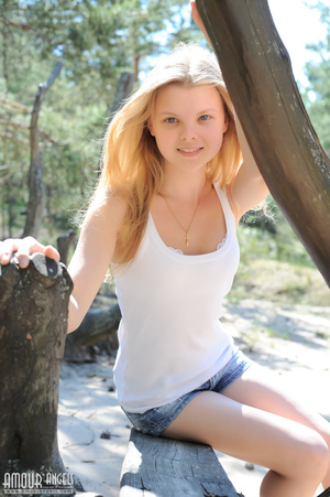 Long-haired teen blonde in jeans shorts undressing outdoors - XXXonXXX - Pic 1