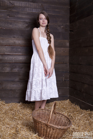 Very hot teen beauty with a plait undresses on the hayloft - Picture 1