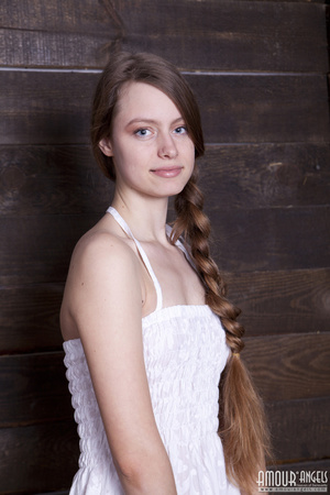 Very hot teen beauty with a plait undresses on the hayloft - Picture 2