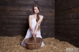 Very hot teen with a thick plait posing nude on the hayloft - Picture 1