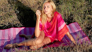 Hot blonde teen Nancy relaxing on a striped blanket outdoors