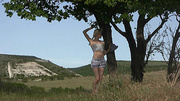 Breathtaking blondie with a plait gets naked outdoors
