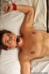 Brown haired bitch wriggles her sexy body on the bed against her binds