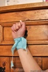 Busty blonde bitch tries to get comfortable while she is tied to a furniture