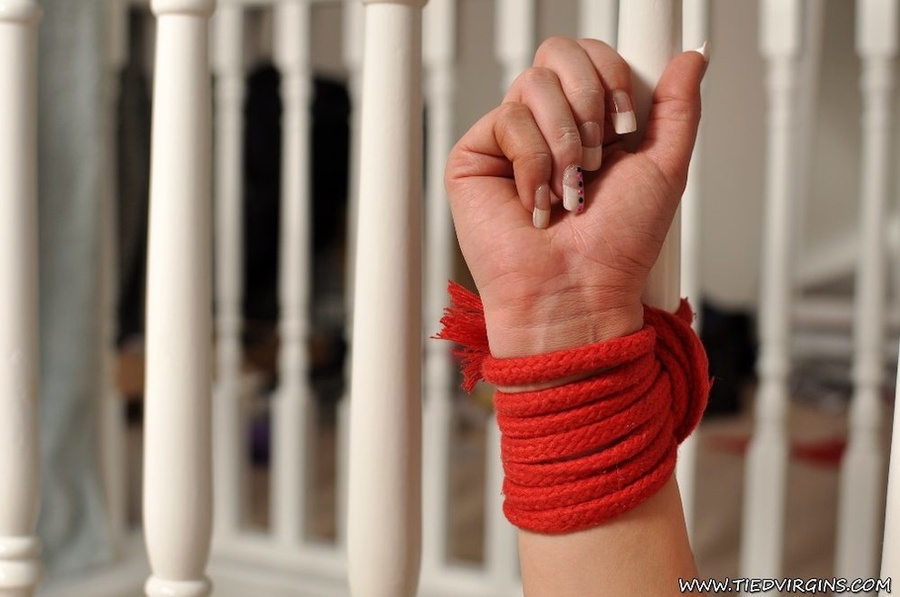 Sexy brunette with wrists bound to the banisters is gagged and apprehensive even with her legs unbound - XXXonXXX - Pic 10
