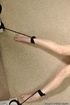 Very naked red haired beauty is on the floor bound to spread eagle to