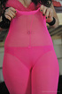 Brunette temptress teases with see-through clothing revealing a peek of