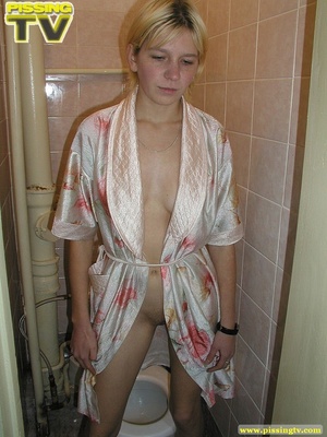 A slutty blonde bitch demonstrates how enjoyable  taking a piss in the toilet can be - XXXonXXX - Pic 16