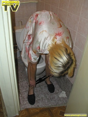 A slutty blonde bitch demonstrates how enjoyable  taking a piss in the toilet can be - XXXonXXX - Pic 17