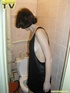 Lusty brunette takes her turn in sitting on the toilet throne and releases