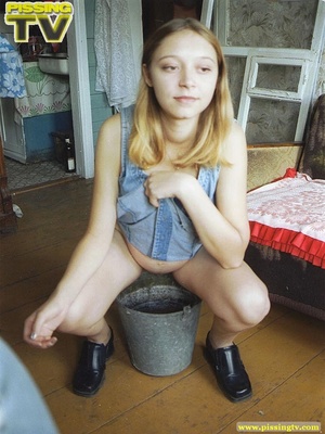 Innocent blonde teen enjoys being able to let loose her steaming golden piss in a bucket where her piss creates so much noise as it splashes - XXXonXXX - Pic 9