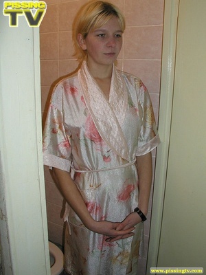 A slutty relaxed blonde bitch demonstrates how enjoyable  taking a piss in the toilet can be - Picture 3