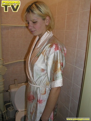 A slutty relaxed blonde bitch demonstrates how enjoyable  taking a piss in the toilet can be - Picture 5