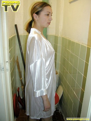 Brunette beauty wearing only a silk robe takes a wonderfully nasty piss inside a very dirty toilet by sitting on the toilet seat - XXXonXXX - Pic 3