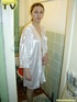 Brunette beauty wearing only a silk robe takes a wonderfully nasty piss