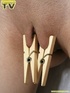 Naive blonde teen is restrained spreadeagle, wearing clamps on her nipples