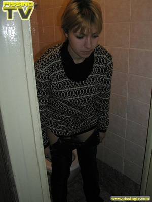 Blonde bitch sits on the toilet and enjoys some moments of wonderful piss coming from her tight sweet cunt - Picture 4