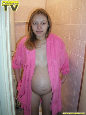 Luscious pregnant brunette teen takes her seat in the toilet and lets out a steaming golden piss from her shaved pussy - XXXonXXX - Pic 7
