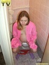 Luscious pregnant brunette teen takes her seat in the toilet and lets