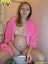 Luscious pregnant brunette teen takes her seat in the toilet and lets