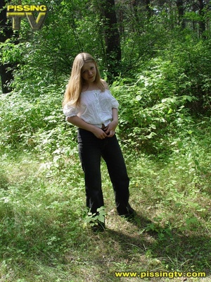 Horny blonde teen pulls down her pants in the forest then takes a glorious piss among the grasses with tips of weeds tickling her ass and pussy - XXXonXXX - Pic 2
