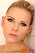 Lusciously naked blonde bitch is squatted over a bathtub and is fondling