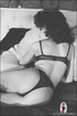 curly haired brunette lounging