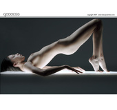 Bodacious dark-haired teen with a topknot posing nude variously