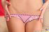 Slim fair-haired gal in pink thong loves to pose topless