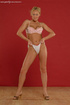 Ponytailed blonde undresses to play with her undies