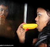 Breath-taking swarthy freshie licking wooden banana in front of the mirror