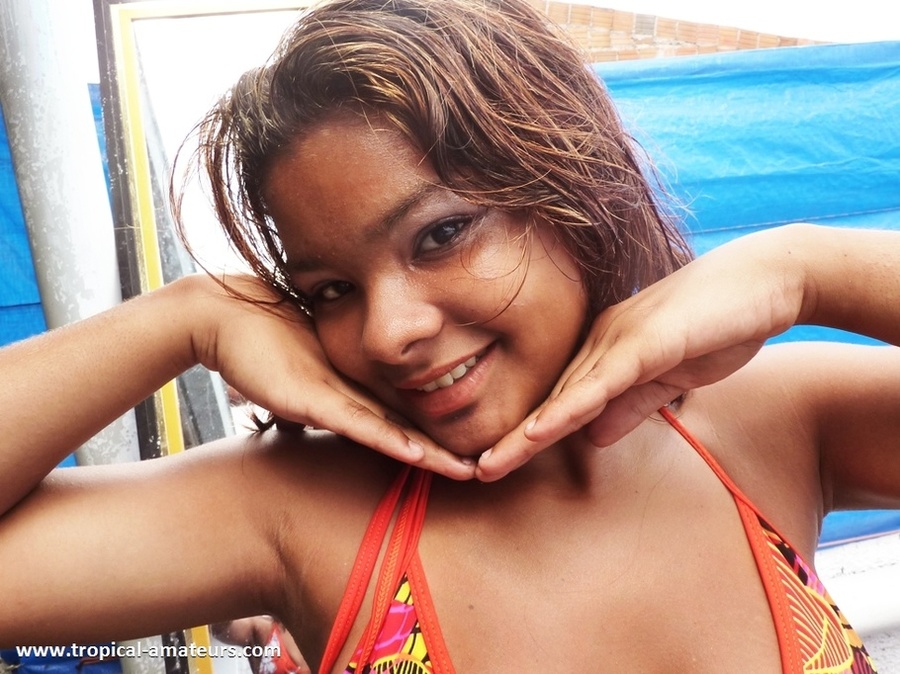Swarthy teen babe in orange bikini looking very seductive - XXXonXXX - Pic 1
