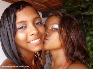 Two nasty exotic girl posing in bright bikinis kissing - Picture 8