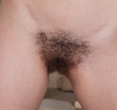 Hot chick in glasses bends to take a piss and opens wide to show her hairy