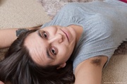 Horny chick with hairy pits takes off clothes to expose dark hairy pussy