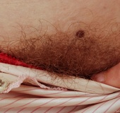 Hot red head chick looks far more erotic when shoing her red hairy pussy