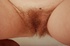 Hot red head chick looks far more erotic when shoing her red hairy pussy