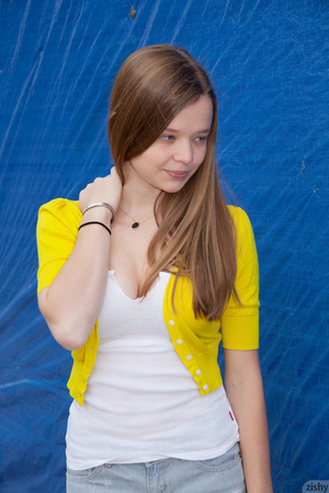 Adorable slim long-haired teen girl posi - Picture 1