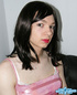 Pretty in glossy pink dress as an alluring crossdresser seductive poses