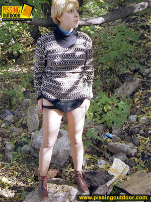 Cute short hair blonde bends down to take a piss out in the woods in early autumn - Picture 3